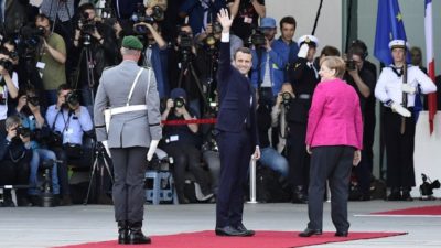 Macron received with military honours in Berlin on inaugural trip