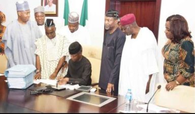 Hope rises for Nigeria as Osinbajo, backed by Buhari, signs 2017 budget