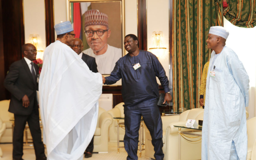 Femi-Adesina-stands-with-Buhari.jpg
