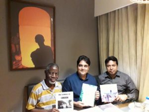 UK-based Nigerian author, Mr. Ben Igiebor, at a meeting with Rotarian Masud Parvev and his host Rotarian Noyon Jihadul, displaying his four books, at a meeting at Chittagong Bull Hotel in Gulshan, Dhaka, Bangladesh, on Sunday April 4, 2018.