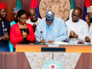 Buhari signs “Not Too Young to Run” Bill into law, charges youths to leave their mark