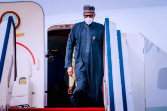 PHOTO: President Buhari returns to Abuja after Paris Summit