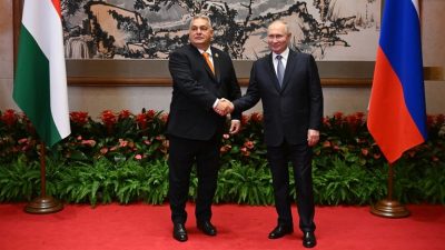 Putin meets EU-defying Orban in China